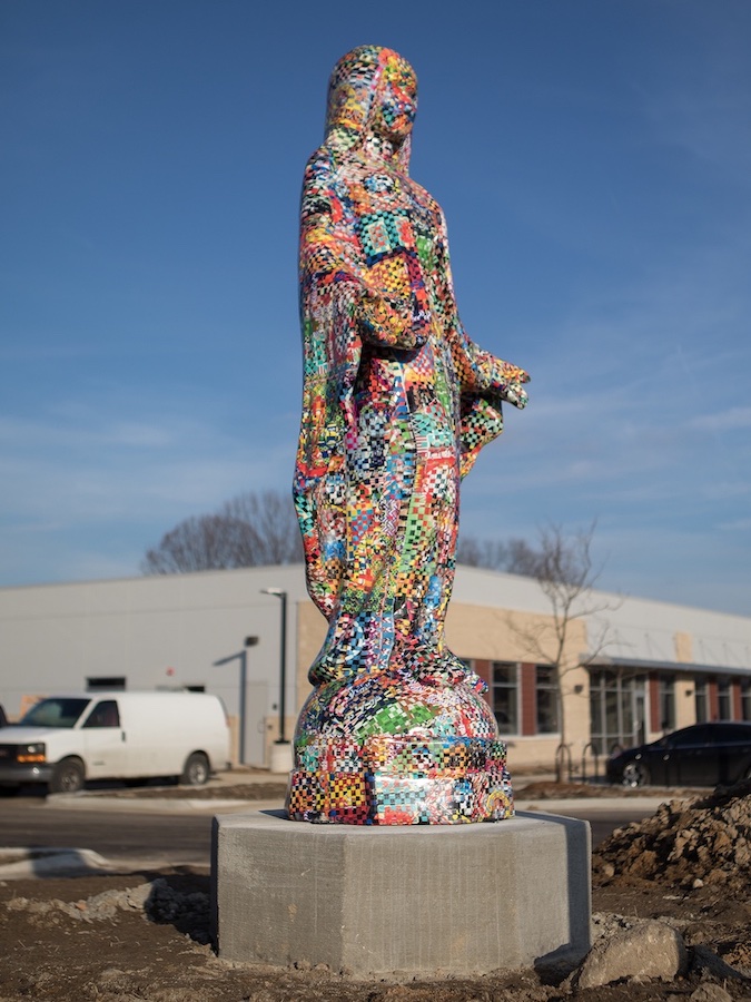 side view of Virgin Mary colorful statue by Jonpaul Smith in photo by