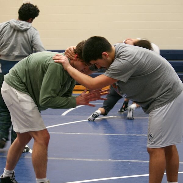 Woodward Builds a Family and a Contender in East Lansing Wrestling Program